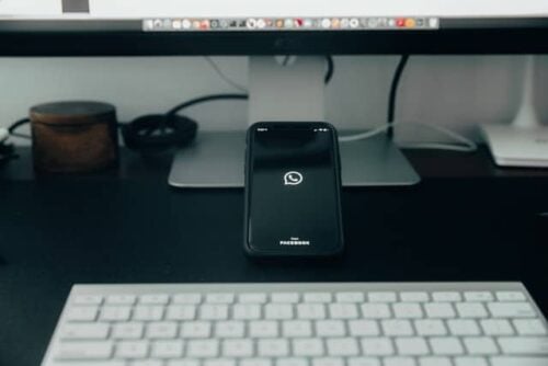 phone with whatsapp logo on desk